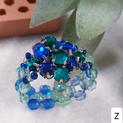 brillantini blu zaffiro verde smeraldo cristalli Swarovski shop anelli bigiotteria di perline perle pietre intreccio schema tecnica fatti a mano con filo e basi 