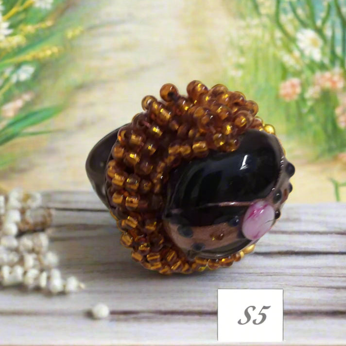 pietra con fiorellino rosa, rame e shop anelli fatti a mano bigiotteria di perline perle pietre intrecciati bijoux  con filo e basi cristalli Swarovski componenti di murano