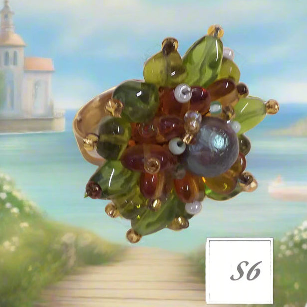 ambra topazio verde olive a margherita shop anelli fatti a mano bigiotteria di perline perle pietre intrecciati bijoux con filo e basi cristalli Swarovski componenti di murano