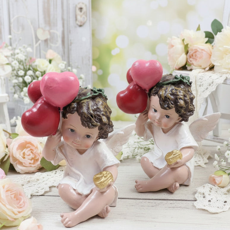 profilo di statuette angelo cupido san valentino confezione regalo cuoricini palloncini rossi angioletto seduto cuore dorato oggettistica regalo vetrinistica