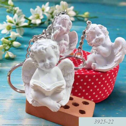 gesso bianco portachiavi forma di angioletto in lettura meditazione silenzio angeli bomboniere statuine Battesimo Comunione Cresima 18 anni diciottesimo compleanno