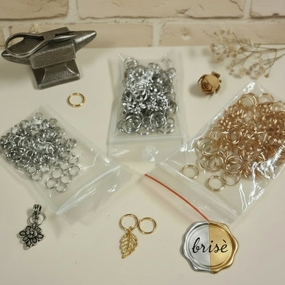 brisè anellini doppi cerchietti a spirale doppio giro minuteria bigiotteria fai da te gioielli di perline con ciondoli charms colore oro bronzo bianco piccoli grandi
