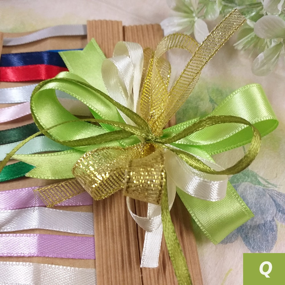vetrina verde oro anniversario matrimonio nozze d'oro cinquantesimo 50 anni per coccarde fiocchi pronti fai da te bomboniere confezionare scatole packaging confezioni pacchi regalo nastrini colorati dorati