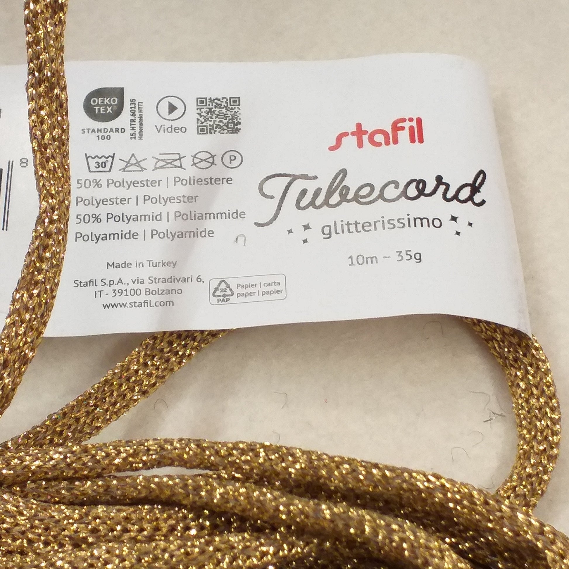 composizione poliestere colore oro tricotin da riempire di filo modellabile filato brillantini glitter corda scritta cordino lurex glitterissimo lamè stafil tubecord cordoncino tubolare pronto per nomi ghirlande fuoriporta centrotavola packaging pacchi confezioni regalo Natale