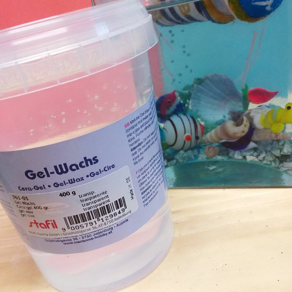 Candele fai da te acquario con cera trasparente gelatina idea bicchiere pesciolini conchiglie