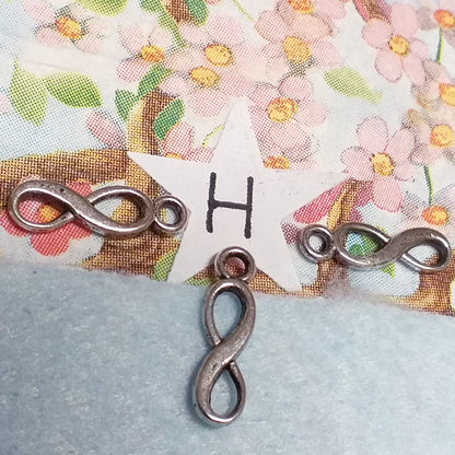 simbolo infinito ciondoli metallo charms pandora-style per fettuccia tubolare uso creare borse bracciali collane bijoux di bigiotteria fai da te con perle di metallo foro grande passante